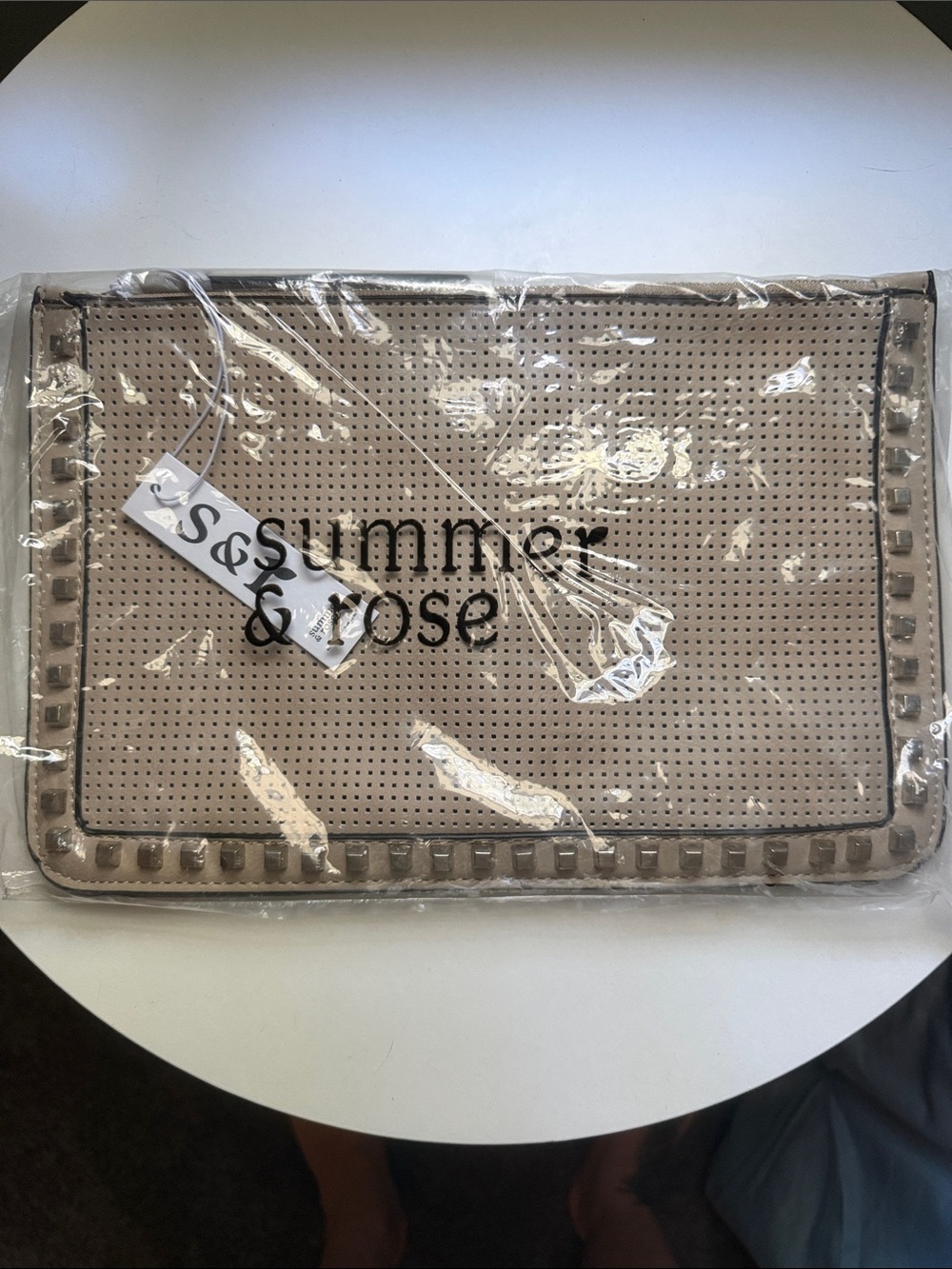 summer & rose taupe perforated wristlet clutch with stud trim